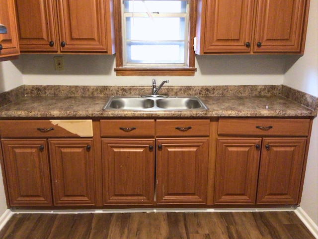 kitchen featuring sink and dark hardwood / wood-style floors