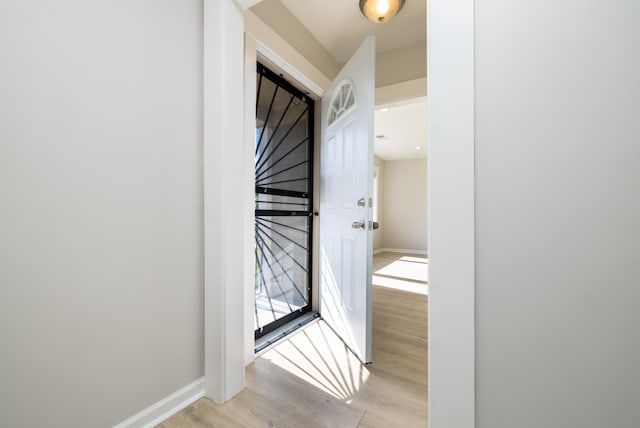 1111 N Watkins St, Memphis, TN 38107 - hallway featuring light wood-type flooring and a barn door