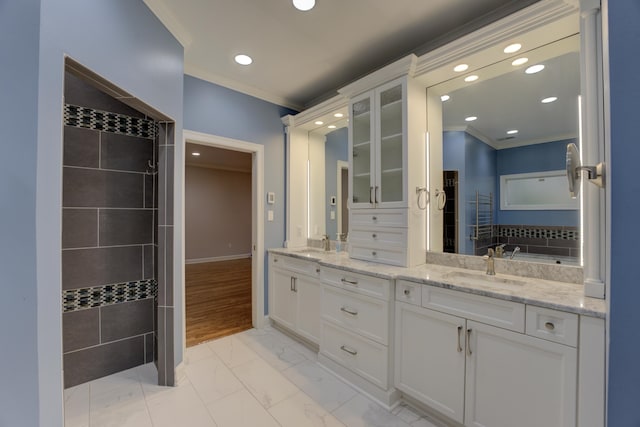 bathroom featuring wood-type flooring, vanity, and crown molding