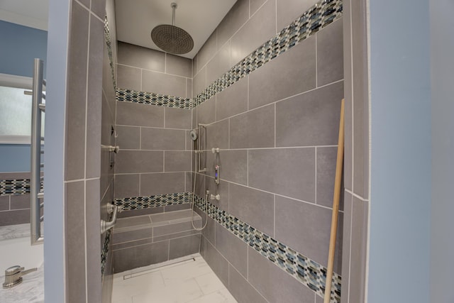 bathroom with a tile shower