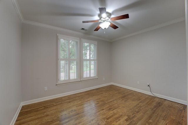 empty room with wood-type flooring, ceiling fan, and crown molding