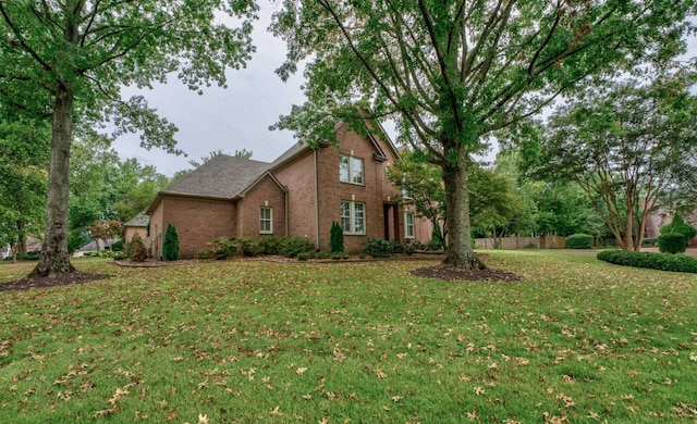 view of home's exterior featuring a yard