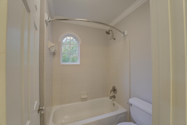 bathroom with toilet, tiled shower / bath, and ornamental molding