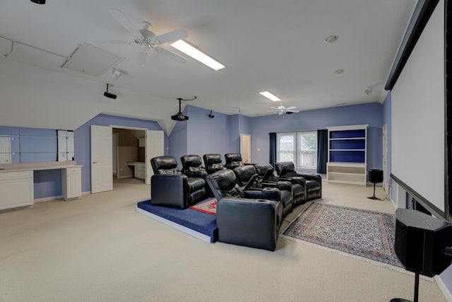 cinema room with light carpet and ceiling fan