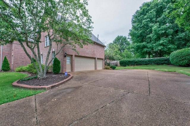 view of side of home with a garage