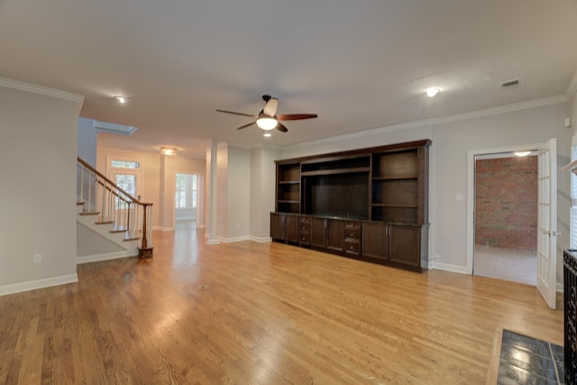 unfurnished living room featuring light hardwood / wood-style floors, ceiling fan, and ornamental molding