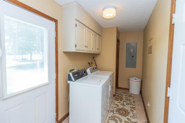 washroom featuring electric panel, cabinets, independent washer and dryer, and a textured ceiling