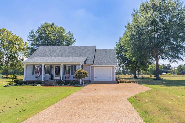 view of front of property with a porch, a garage, and a front lawn