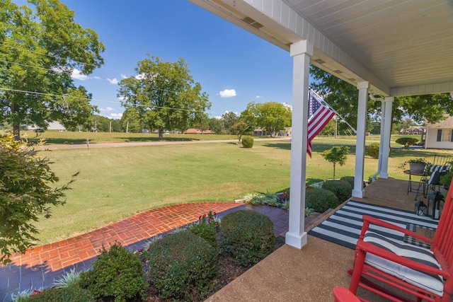 view of yard with covered porch