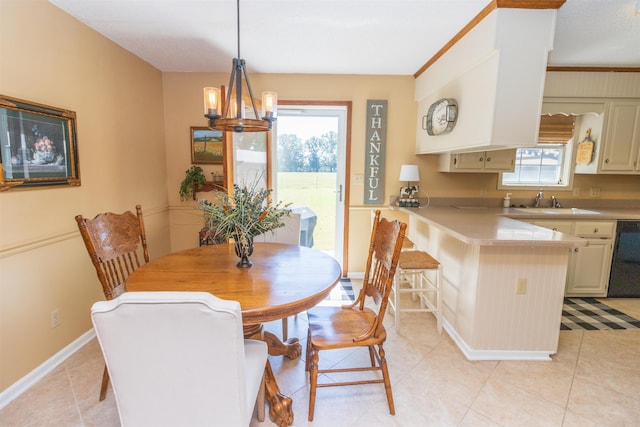 tiled dining room with a notable chandelier and sink