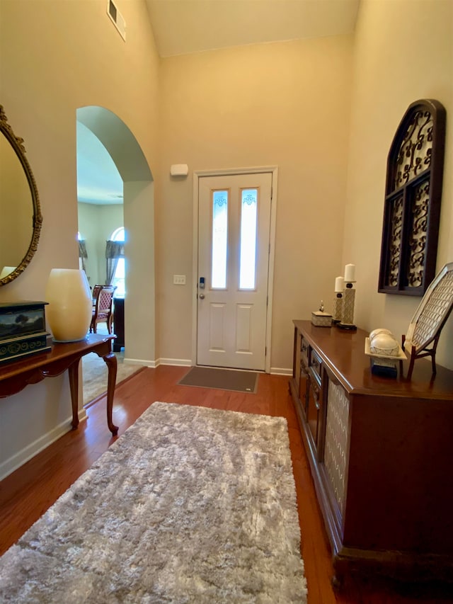 entrance foyer featuring dark hardwood / wood-style flooring