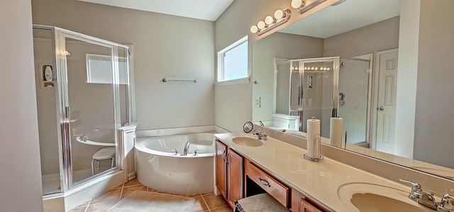 full bathroom with a stall shower, tile patterned flooring, a sink, and a bath