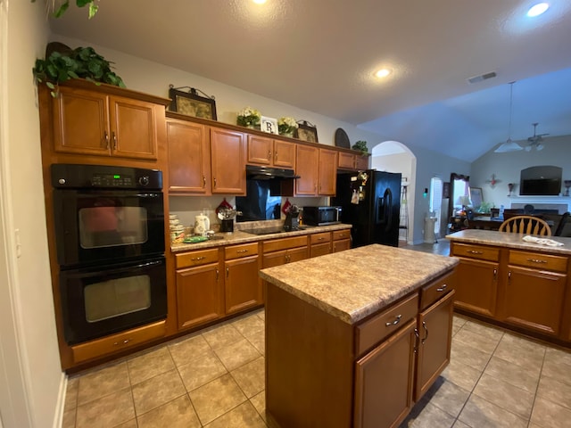 kitchen with light tile patterned floors, black appliances, a kitchen island, ceiling fan, and lofted ceiling