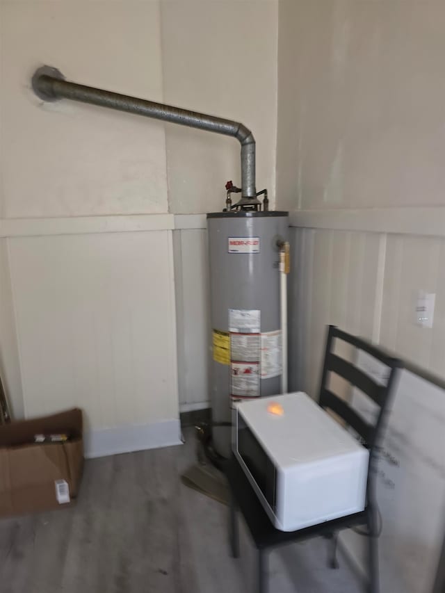 utility room featuring gas water heater