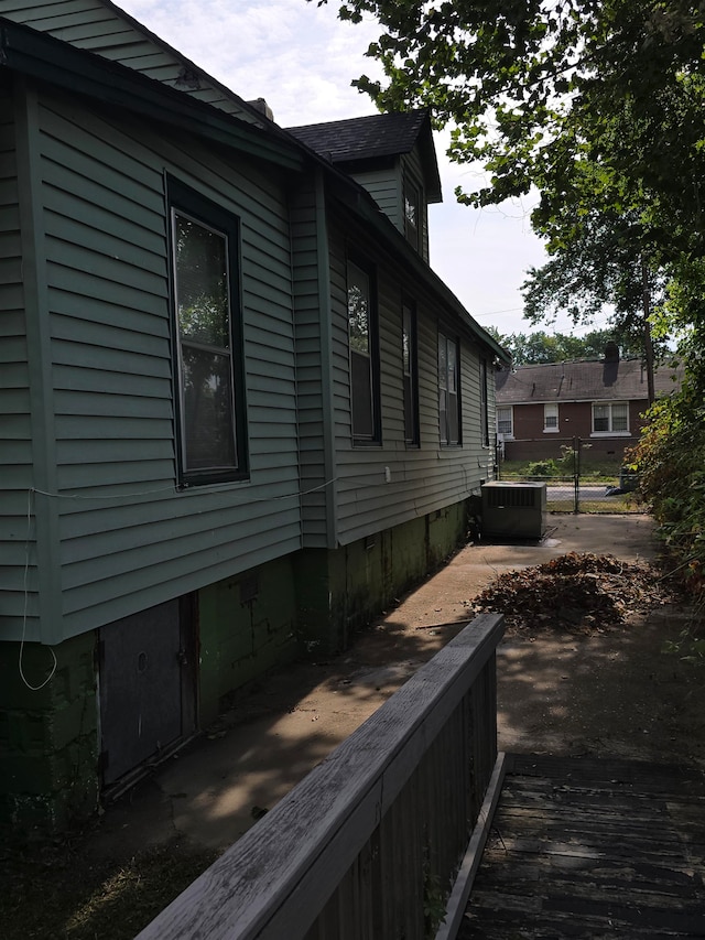 view of home's exterior with central AC unit