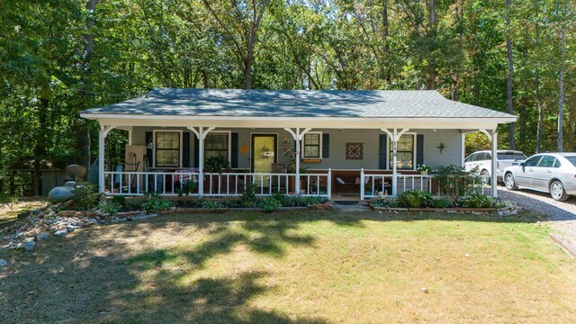 view of front of house with a front yard and a porch