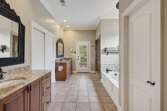 full bath with crown molding, visible vents, a sink, and tile patterned floors