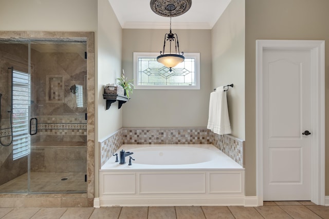 full bath with ornamental molding, tile patterned flooring, a shower stall, and a bath