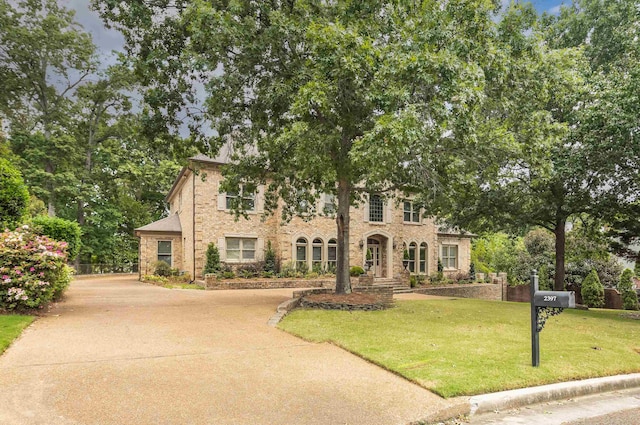 view of front of home with a front lawn