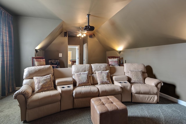 carpeted cinema room featuring lofted ceiling, a ceiling fan, and baseboards