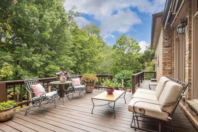 wooden terrace featuring outdoor lounge area