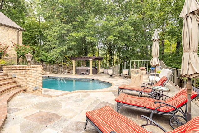 view of swimming pool featuring fence, a fenced in pool, a pergola, a patio area, and a hot tub