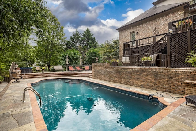 view of swimming pool with a fenced in pool, a patio, and fence