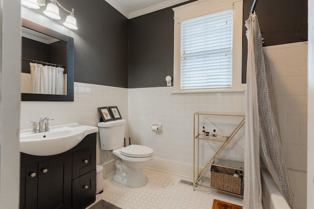 full bathroom with vanity, shower / bathtub combination with curtain, tile walls, crown molding, and toilet