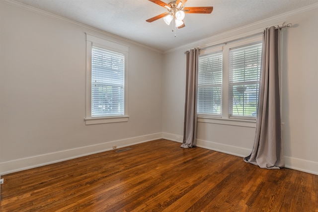 empty room featuring ceiling fan, ornamental molding, dark hardwood / wood-style flooring, and a wealth of natural light