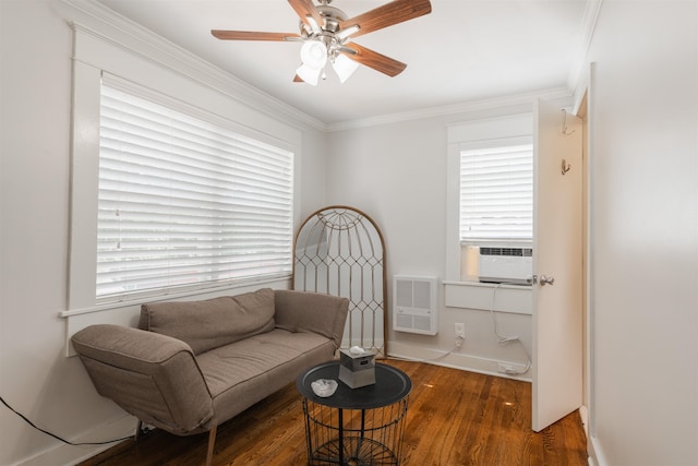 living area featuring ornamental molding, a wealth of natural light, ceiling fan, and dark hardwood / wood-style flooring