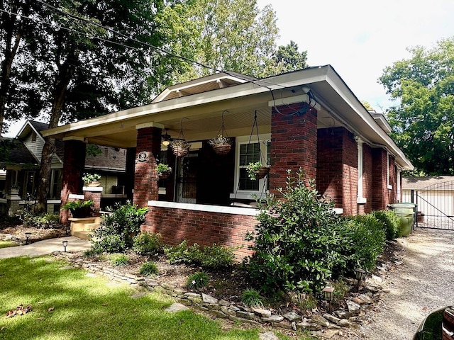 view of side of home with covered porch