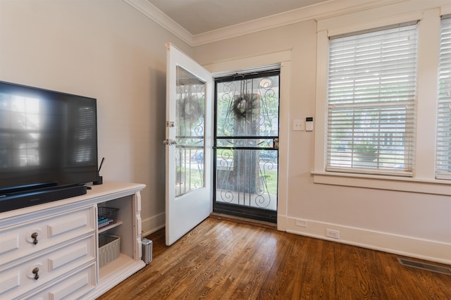 entryway with crown molding and dark hardwood / wood-style floors