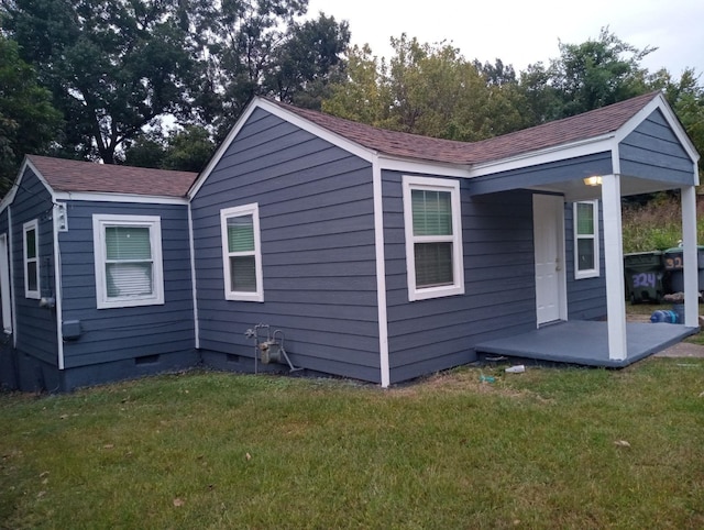 324 Harrell St, Memphis, TN 38112 - view of side of home with crawl space, a lawn, and a shingled roof