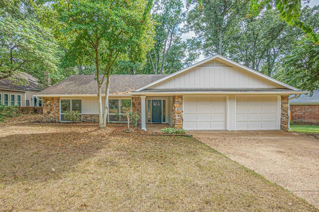 ranch-style house featuring a garage