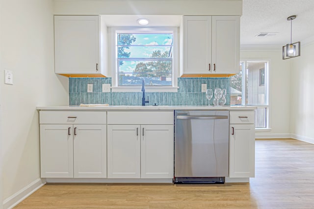 kitchen featuring dishwasher, sink, white cabinetry, and light hardwood / wood-style floors