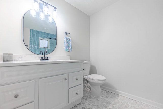 bathroom featuring vanity, toilet, and tile patterned floors