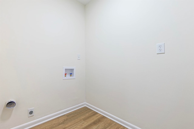 clothes washing area with washer hookup, wood-type flooring, and hookup for an electric dryer