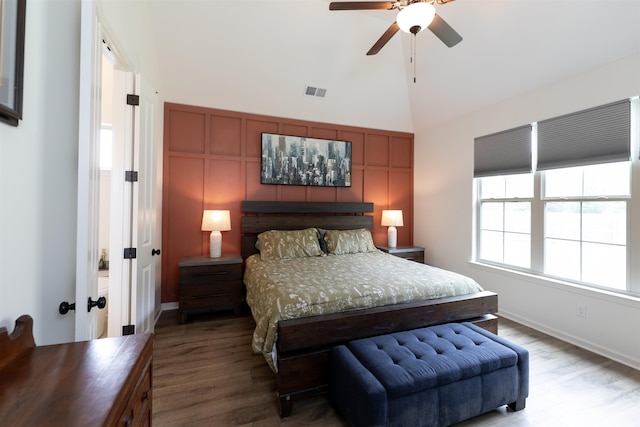 bedroom with lofted ceiling, ceiling fan, and hardwood / wood-style flooring