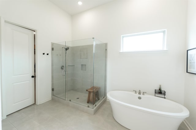 bathroom featuring independent shower and bath and tile patterned floors