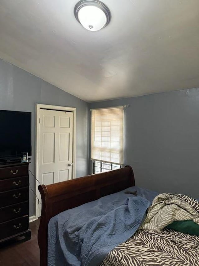 bedroom featuring lofted ceiling