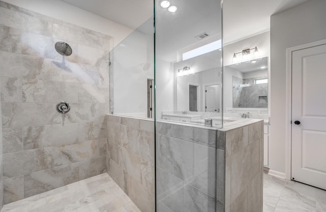 full bath with visible vents, a walk in shower, and double vanity