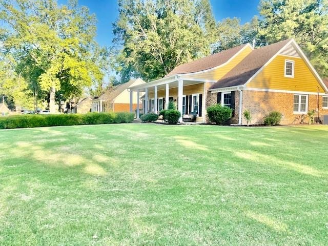 view of front of home with a front lawn and a porch