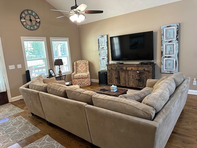 living room with dark wood-type flooring and ceiling fan