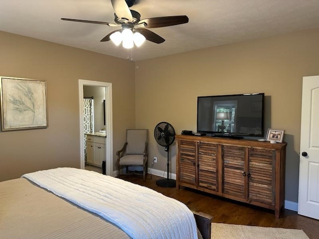 bedroom featuring dark wood-type flooring, ceiling fan, and ensuite bath