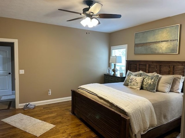 bedroom featuring dark wood-type flooring and ceiling fan