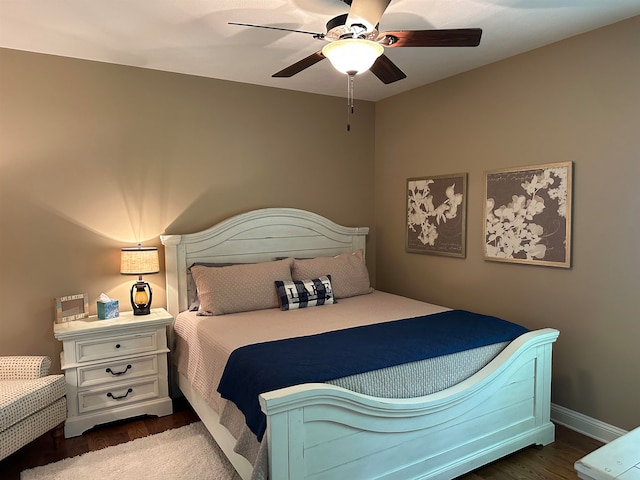 bedroom featuring dark hardwood / wood-style flooring and ceiling fan