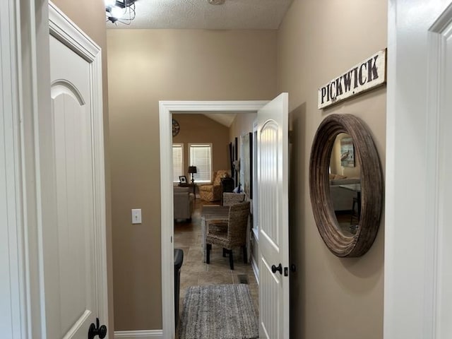 interior space featuring a textured ceiling and tile patterned floors