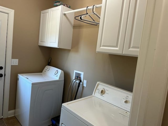 laundry area with cabinets and washer and clothes dryer