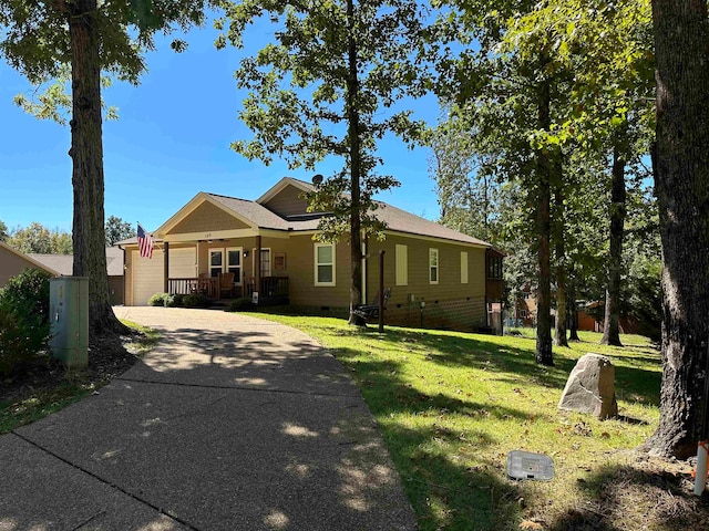 single story home with a porch and a front lawn