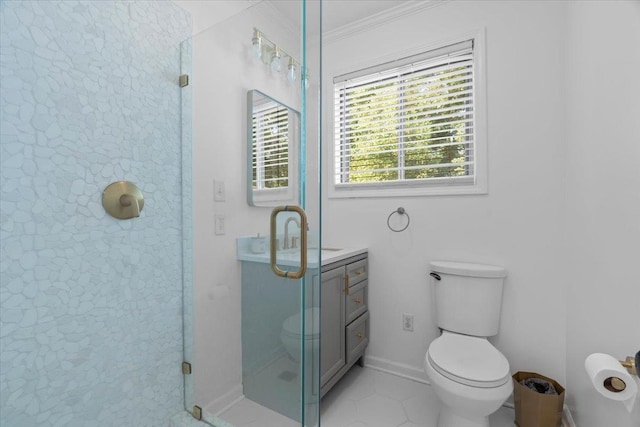 bathroom with vanity, a stall shower, crown molding, toilet, and tile patterned floors